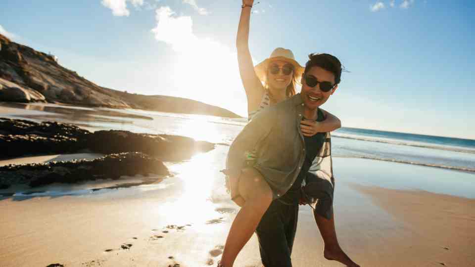 happy couple holiday travel clinic Manchester